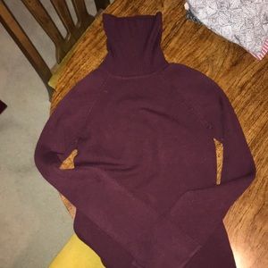 Women’s long sleeve turtle neck sweater.